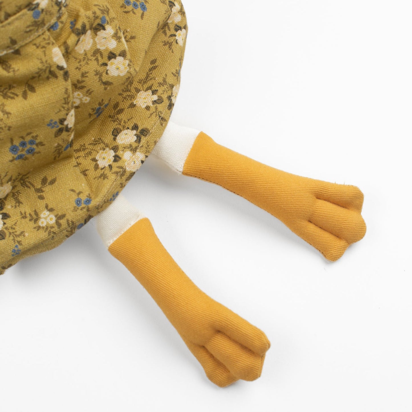 Meet Birdie, the softie duck doll by Bonnie Christine, dressed in a breezy floral linen dress and handcrafted from soft cotton, perfect for children’s playtime, snuggles, or adding a whimsical charm to any child’s space or nursery shelf decor.