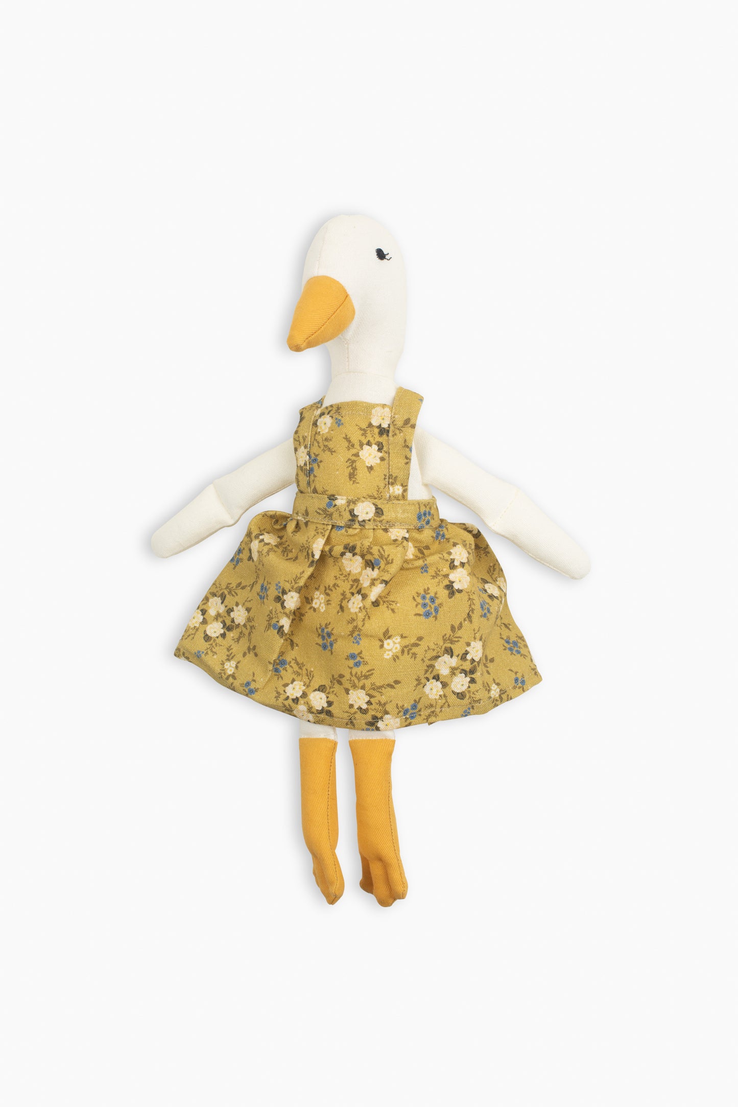 Meet Birdie, the softie duck doll by Bonnie Christine, dressed in a breezy floral linen dress and handcrafted from soft cotton, perfect for children’s playtime, snuggles, or adding a whimsical charm to any child’s space or nursery shelf decor.