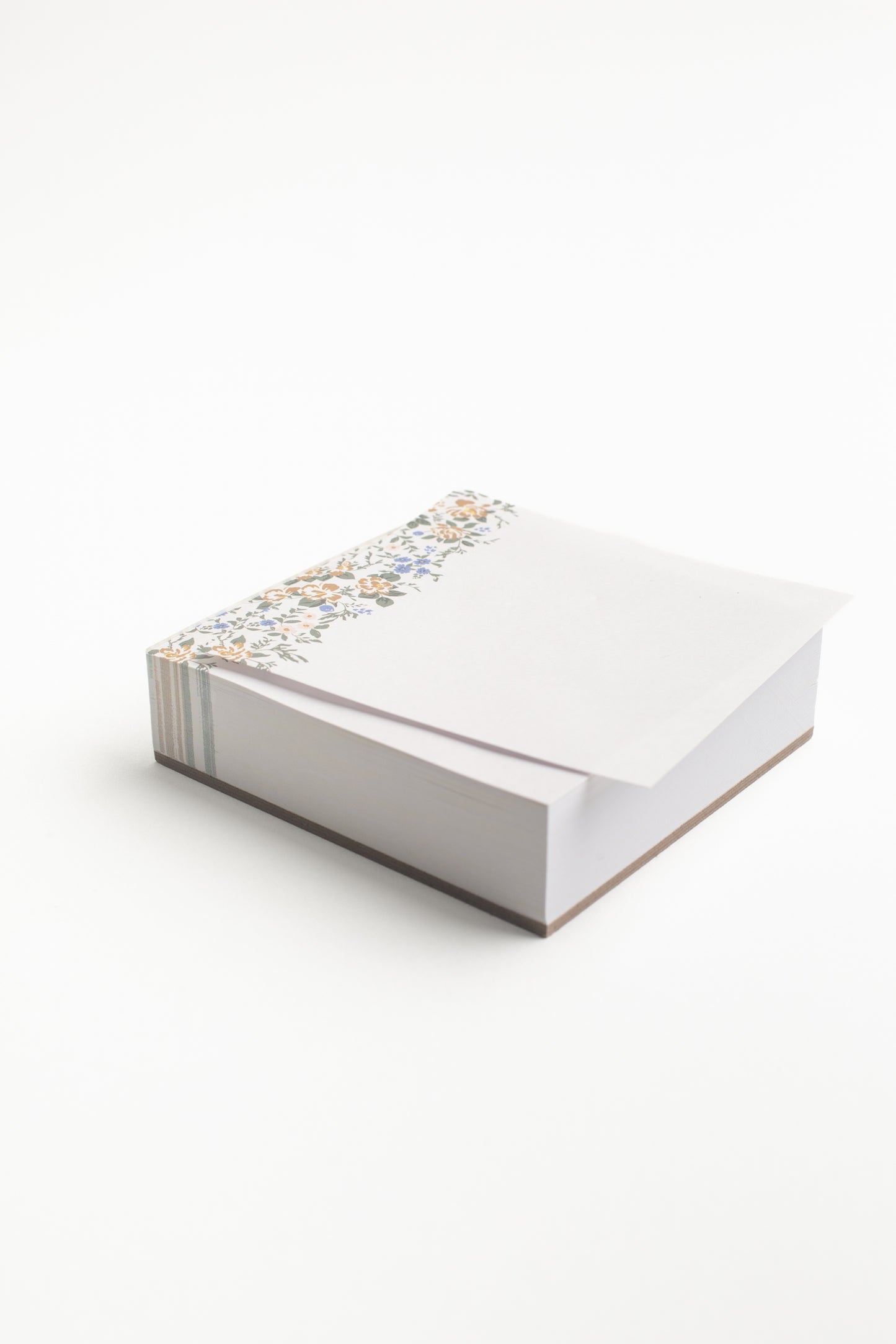 This Blossom Mini Note Block by Bonnie Christine features a charming floral border atop 200 tear-off pages, perfect for jotting quick notes, reminders, or moments of inspiration in a compact and stylish design.