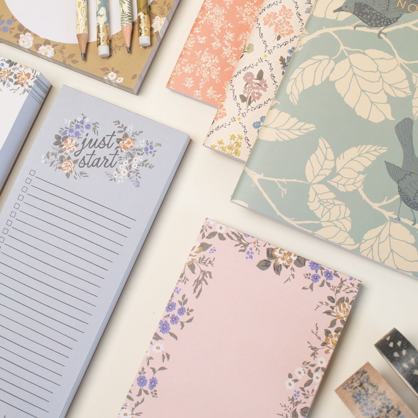 This stationery collection by Bonnie Christine includes the Blossom Mini Note Block, Blossom Small Notepad, Blossom Large Notepad, Blossom List, Pipet Pencil Set, Reverie Notebook Trio Set, and Masking Tape-washi tape all adorned with delicate floral designs, perfect for adding beauty to everyday planning, note-taking, and list-making.