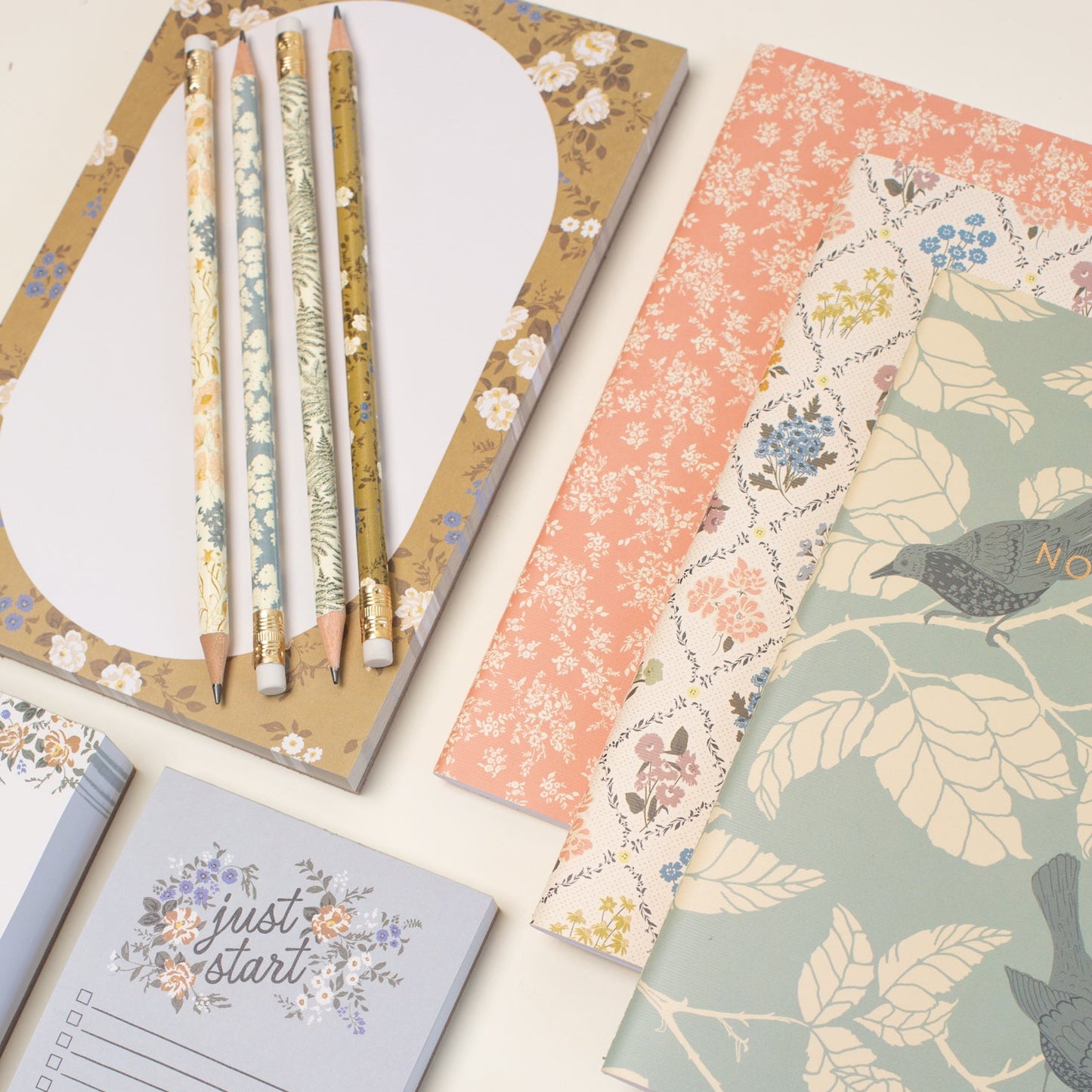 This stationery collection by Bonnie Christine includes the Blossom Mini Note Block, Blossom Small Notepad, Blossom Large Notepad, Blossom List, Pipet Pencil Set, Reverie Notebook Trio Set, and Masking Tape-washi tape all adorned with delicate floral designs, perfect for adding beauty to everyday planning, note-taking, and list-making.