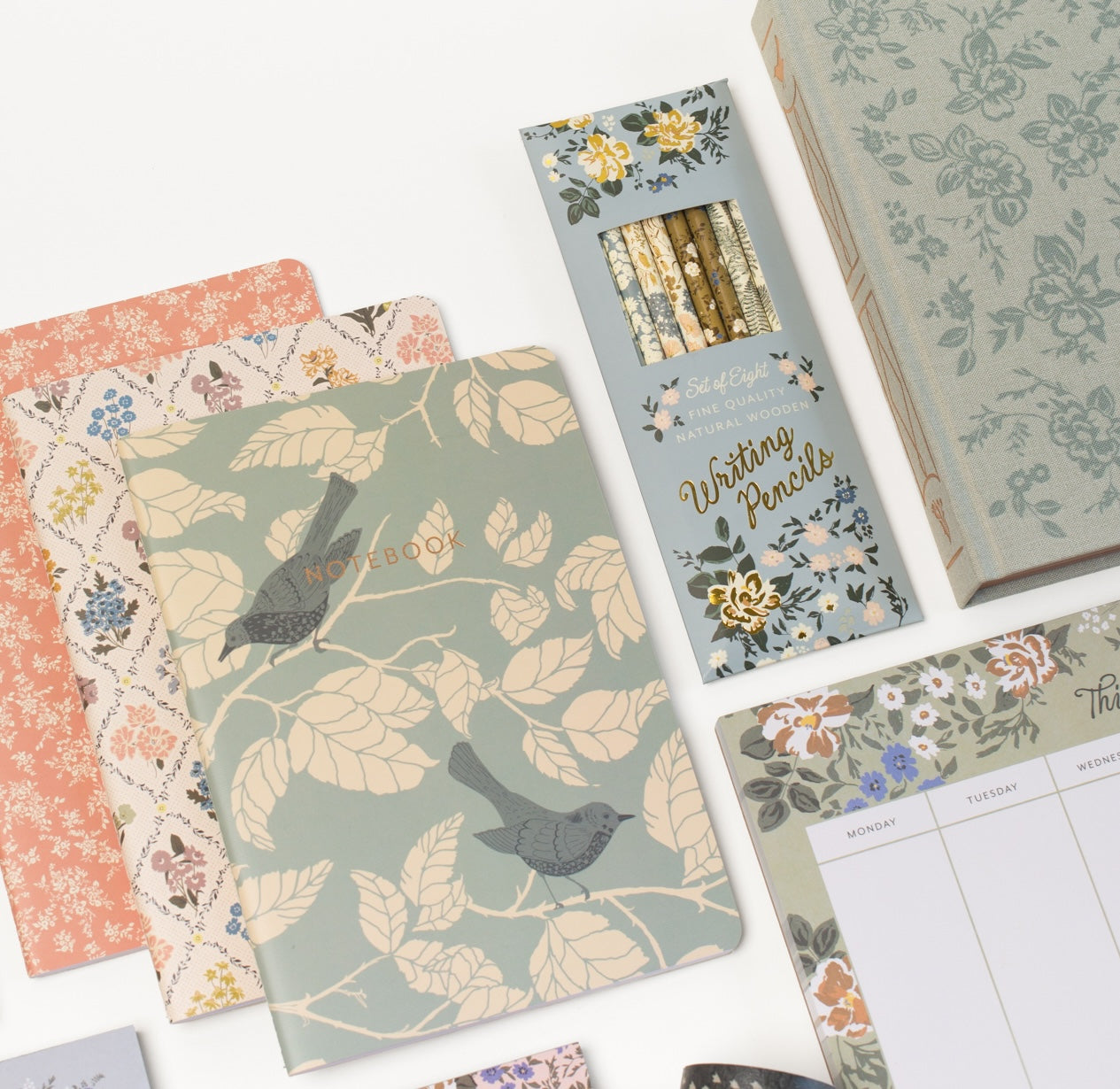 This stationery collection by Bonnie Christine includes the Blossom Mini Note Block, Blossom Small Notepad, Blossom Large Notepad, Blossom List, Pipet Pencil Set, Reverie Notebook Trio Set, and Masking Tape-washi tape all adorned with delicate floral designs, perfect for adding beauty to everyday planning, note-taking, and list-making.
