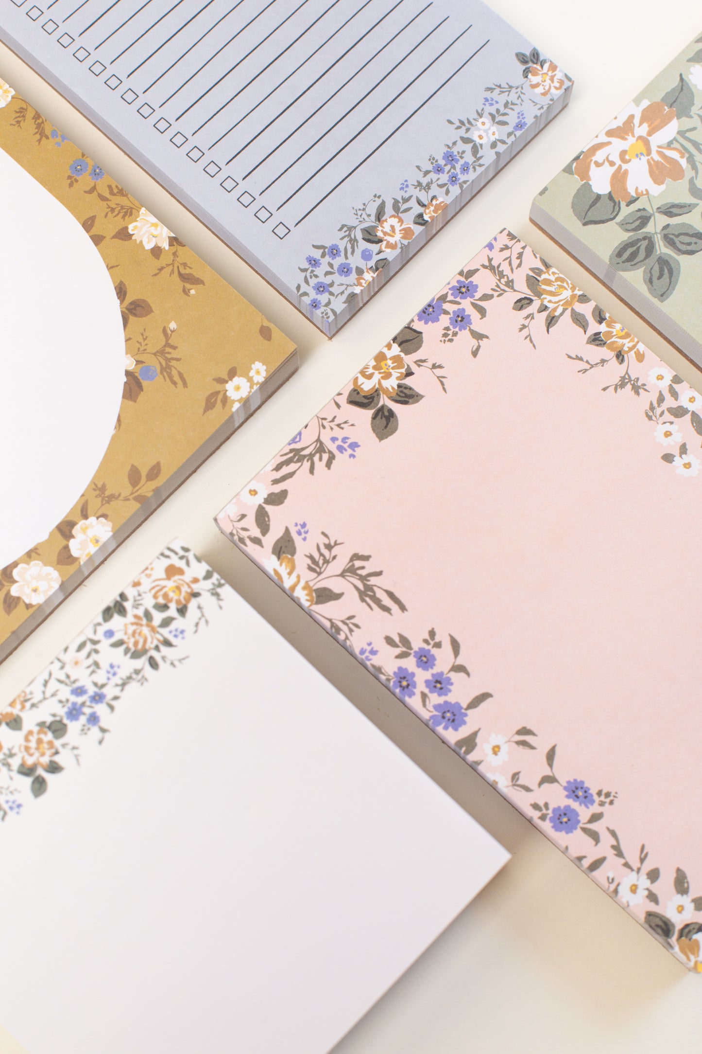 This stationery collection by Bonnie Christine includes the Blossom Mini Note Block, Blossom Small Notepad, Blossom Large Notepad, Blossom Weekly Planner Notepad, and Blossom List, all adorned with delicate floral designs, perfect for adding beauty to everyday planning, note-taking, and list-making.