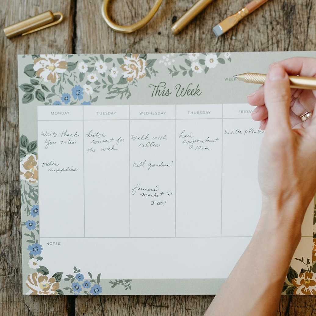 This Blossom Weekly Notepad by Bonnie Christine features 52 tear-off pages on smooth, uncoated paper with soft, hand-drawn florals, perfect for planning meals, scheduling, or setting weekly intentions with a touch of beauty.