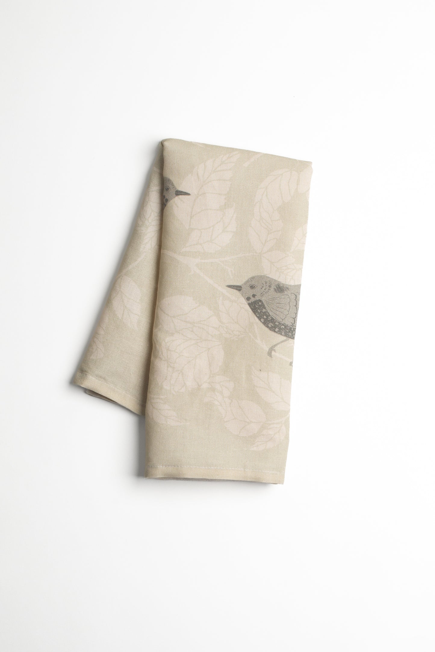 This “Bramble Birds” tea towel by Bonnie Christine captures the quiet beauty of nature with delicate grey birds among soft leafy branches, perfect for adding a rustic touch to a country-style kitchen, gifts, or housewarming.