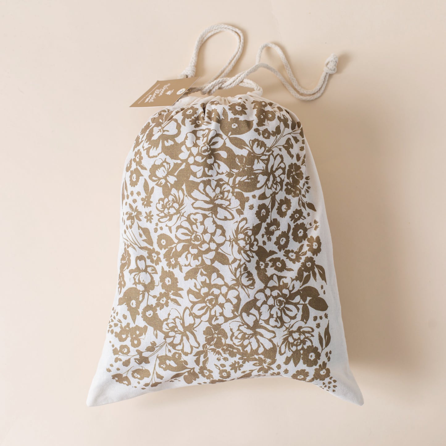This Cocoon Throw Blanket by Bonnie Christine, woven from 100% Carolina-grown cotton in a floral jacquard tapestry, brings a touch of cottage-core charm to cozy home moments, perfect for gifting, layering, or a garden picnic.