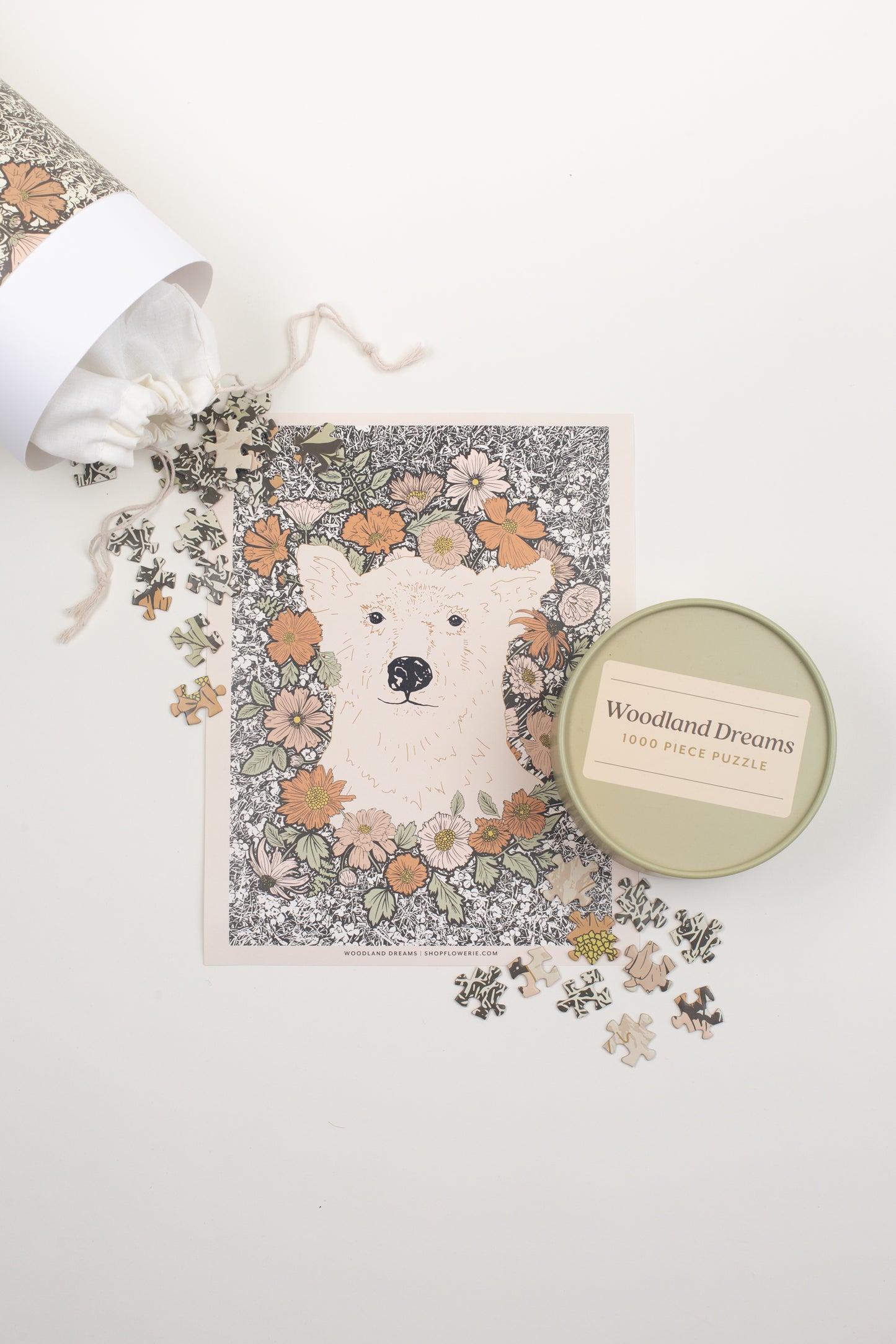This Woodland Dreams Puzzle by Bonnie Christine features a friendly bear and wildflowers in a charming design, with 1000 pieces packaged in a rigid tube box, perfect for gifting or enjoying quiet cottage-core afternoons.